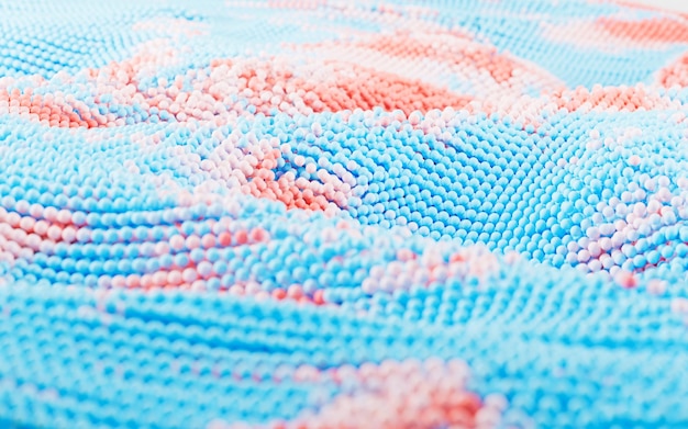 Kawałek haftowanego materiału w pastelowych kolorach